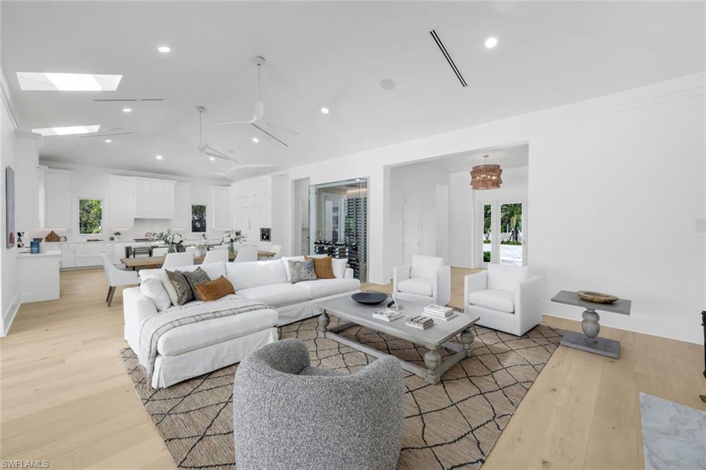3136 Ravenna Avenue Naples, FL 34120 - Photo 14 of 50 Living area with light wood-style flooring, recessed lighting, and a skylight
