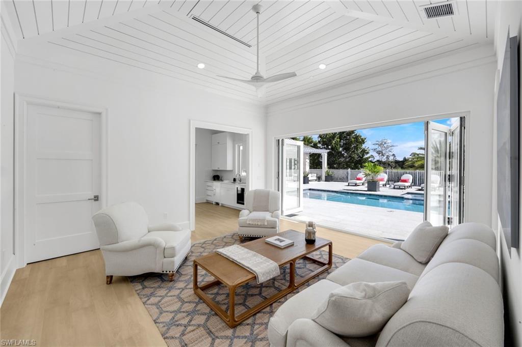 3136 Ravenna Avenue Naples, FL 34120 - Photo 40 of 50 Living room with light wood-style floors, wood ceiling, recessed lighting, and a ceiling fan