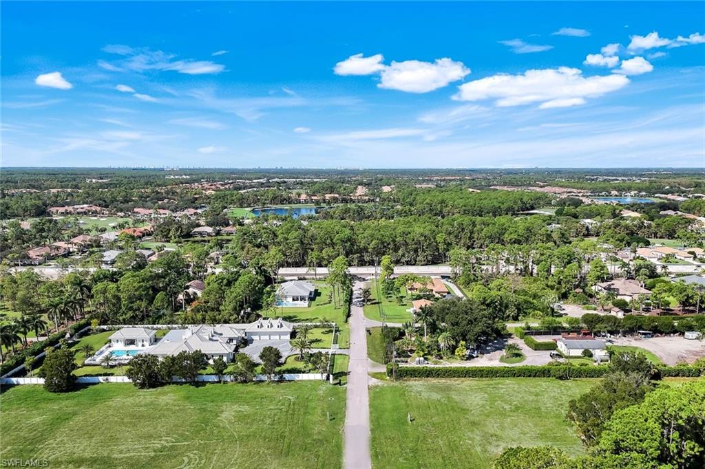 3136 Ravenna Avenue Naples, FL 34120 - Photo 47 of 50 Aerial view of property's location featuring nearby suburban area and a nearby body of water