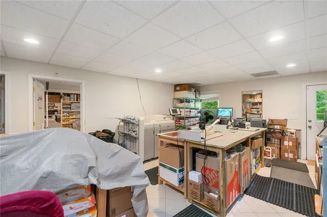 a open kitchen with stainless steel appliances granite countertop a stove and a table