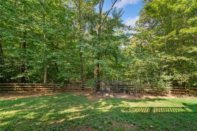 a view of outdoor space with deck and yard