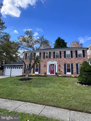 a front view of house with yard and outdoor seating