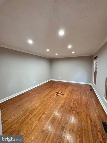 a view of room with wooden floor