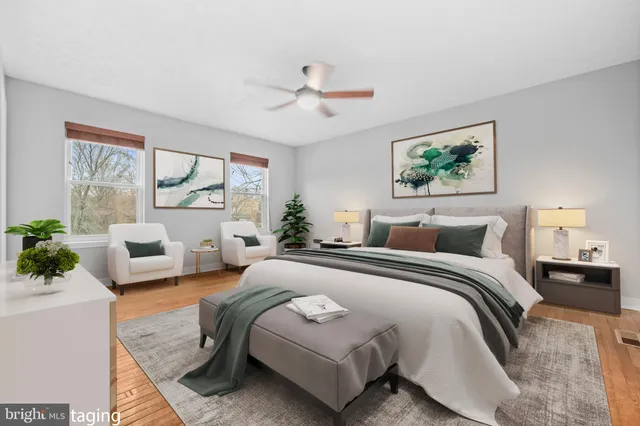 a spacious bedroom with a large bed and a couch