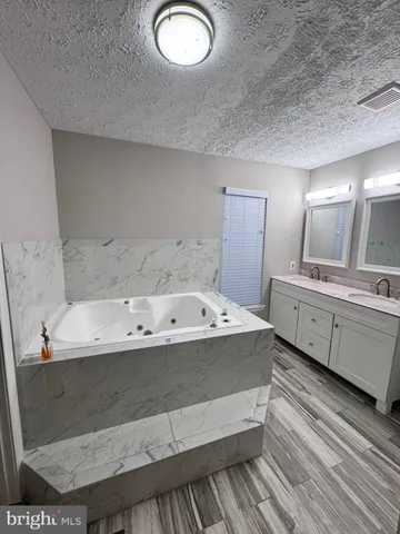 a view of bathroom with dual sinks