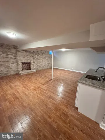 a view of a livingroom with wooden floor