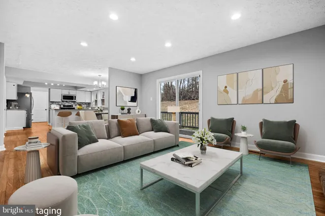 a living room with furniture rug and window