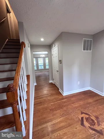 a view of entryway with wooden floor