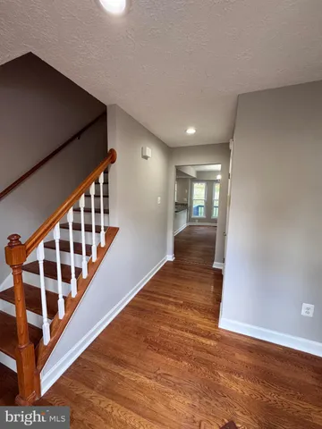 a view of entryway with wooden floor