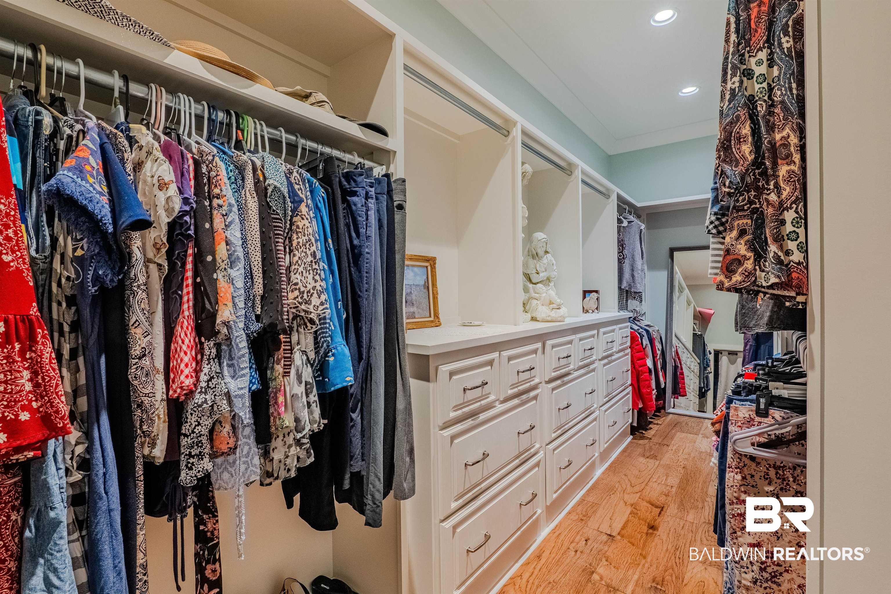 708 Manning Place Fairhope, AL 36532 - Photo 24 of 58 Walk in closet featuring light hardwood / wood-style floors