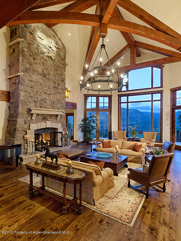 360 Eagle Pines Drive Aspen, CO 81611 - Photo 10 of 40 a living room with patio furniture and a fireplace