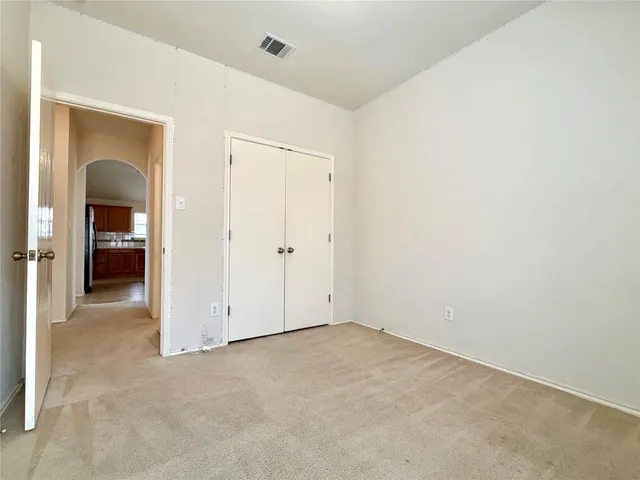 an empty room with a bathroom