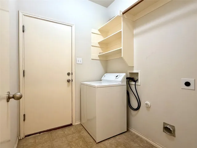 a utility room with a shower