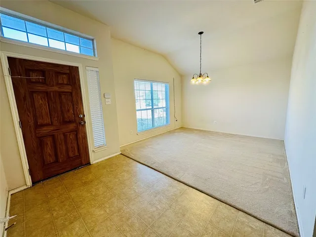a view of empty room with windows