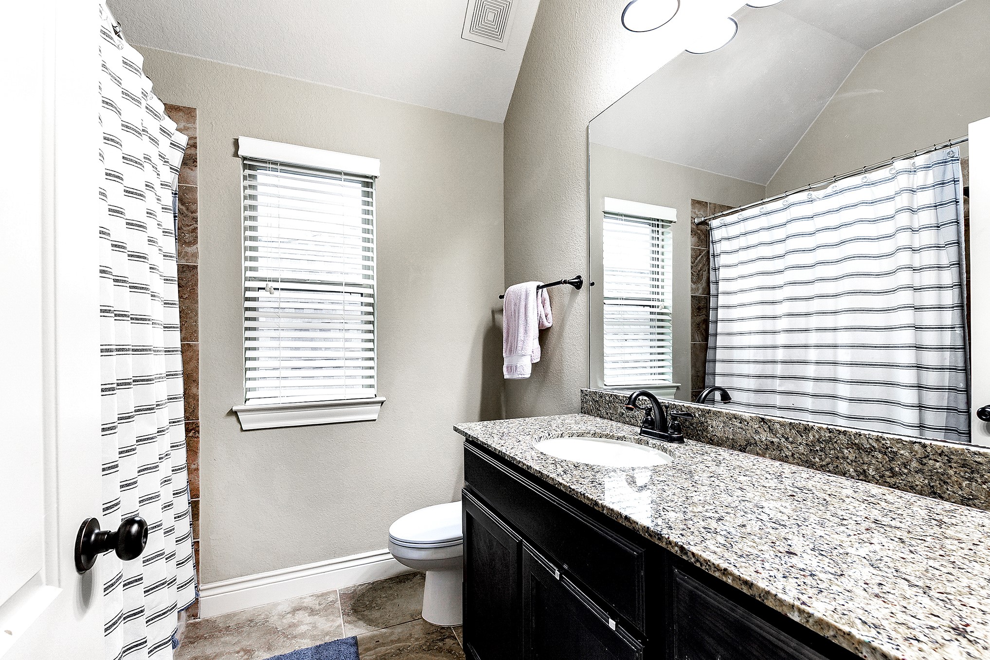 2939 Bobby Jones Road Katy, TX 77494 - Photo 39 of 50 a bathroom with a granite countertop sink a toilet and a bathtub