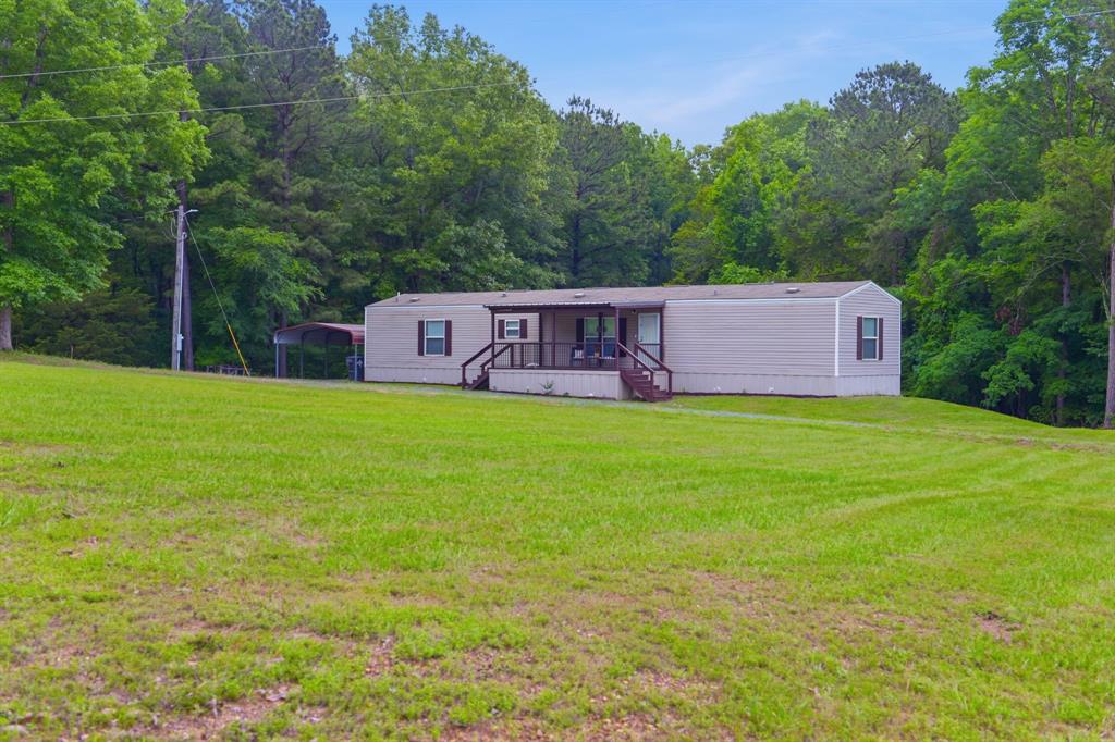127 Almond Road Minden, LA 71055 - Photo 25 of 25 a view of a house with a big yard