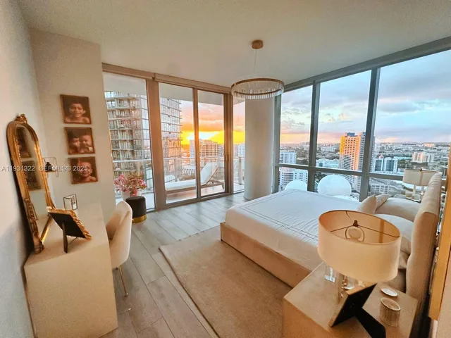 a room with a large window and a table