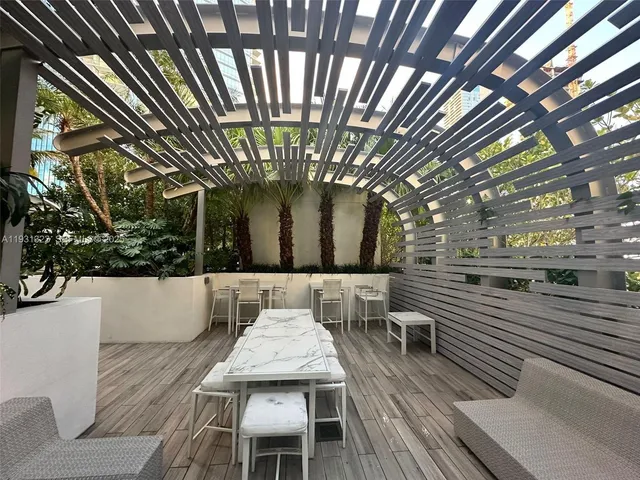 a view of a building with potted plants
