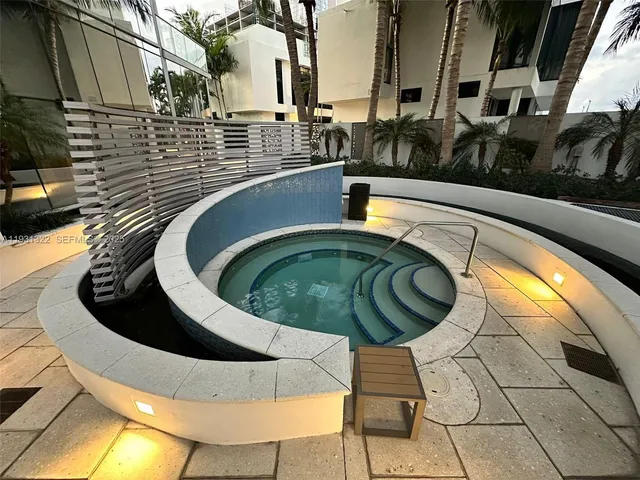 a view of a swimming pool with a chairs