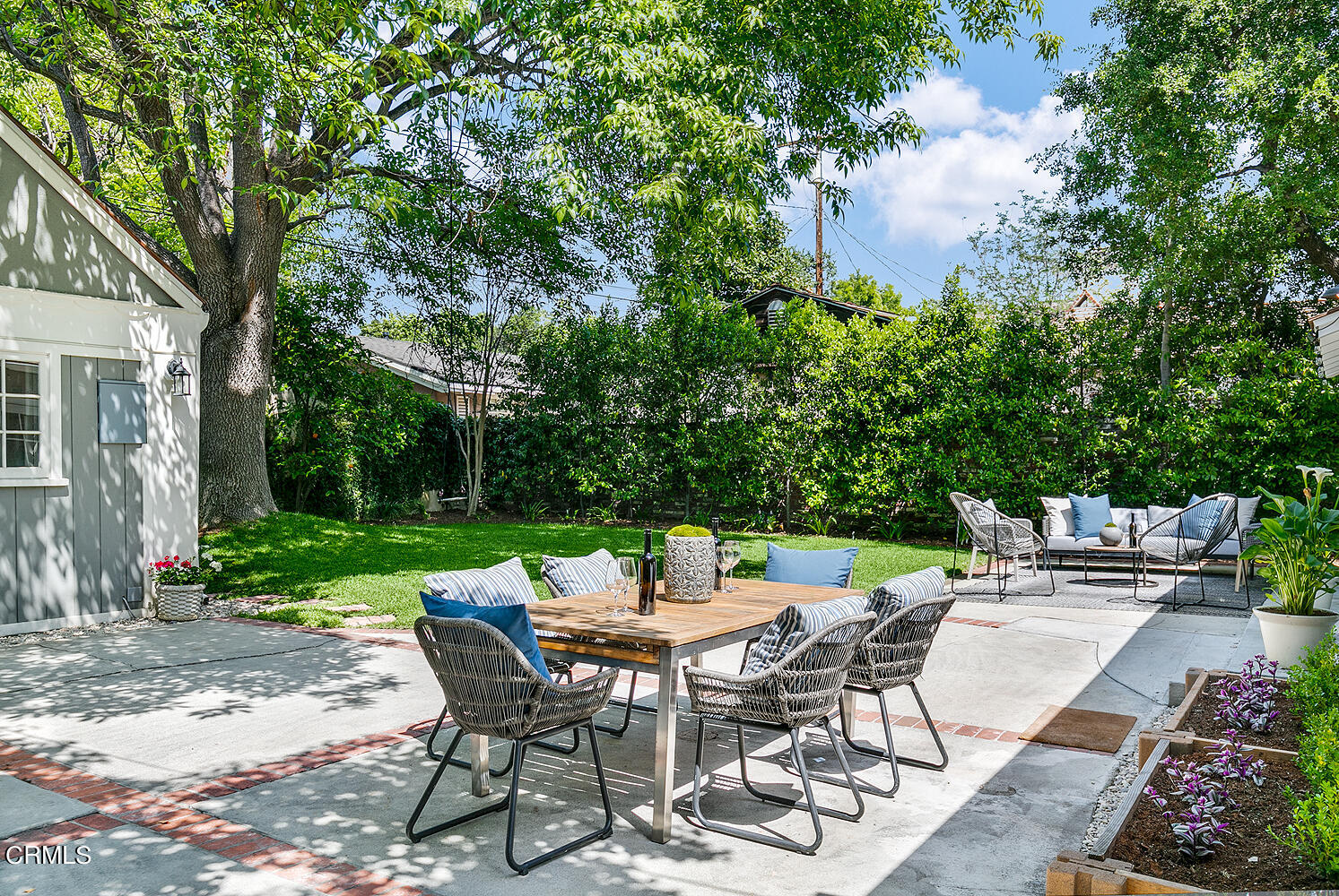 3333 Yorkshire Road Pasadena, CA 91107 - Photo 26 of 34 a view of a patio with a table and chairs in a yard