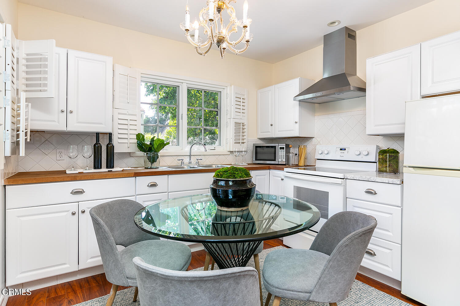 3333 Yorkshire Road Pasadena, CA 91107 - Photo 31 of 34 a kitchen with stainless steel appliances granite countertop a dining table and chairs
