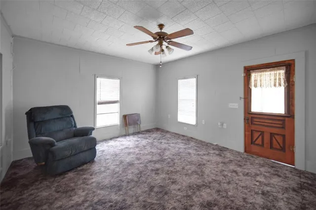 a living room with furniture and windows