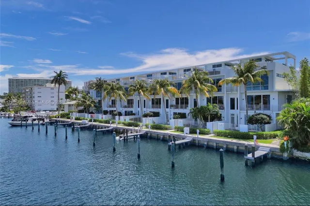 a view of houses with swimming pool and outdoor seating