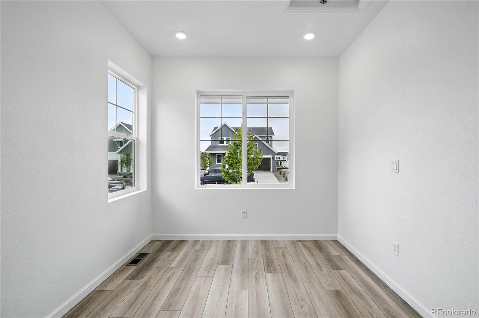 39713 Penn Road Elizabeth, CO 80107 - Photo 11 of 32 a view of an empty room with wooden floor and a window