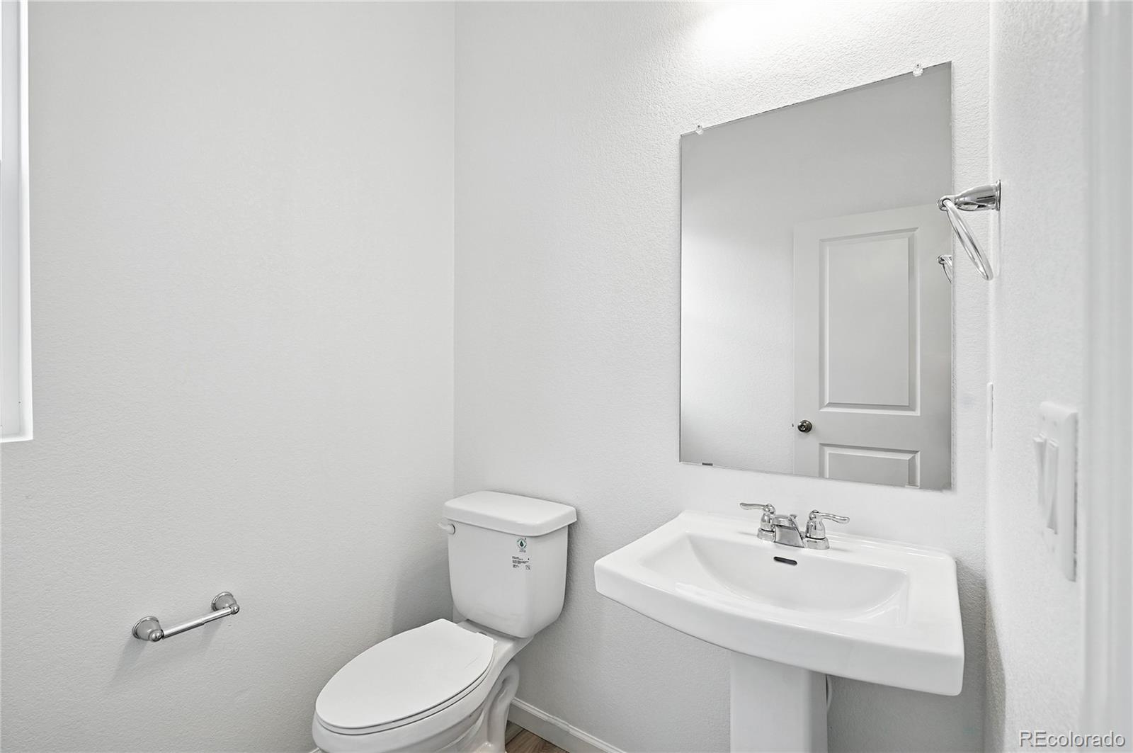 39713 Penn Road Elizabeth, CO 80107 - Photo 13 of 32 a bathroom with a sink a toilet and mirror