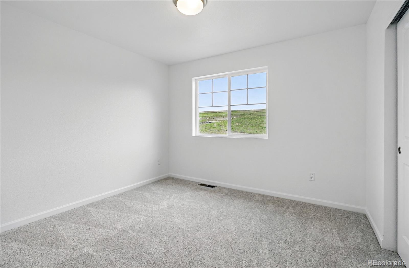 39713 Penn Road Elizabeth, CO 80107 - Photo 18 of 32 an empty room with a window