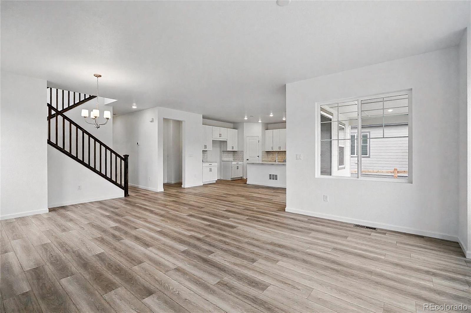 39713 Penn Road Elizabeth, CO 80107 - Photo 2 of 32 a view of empty room with wooden floor