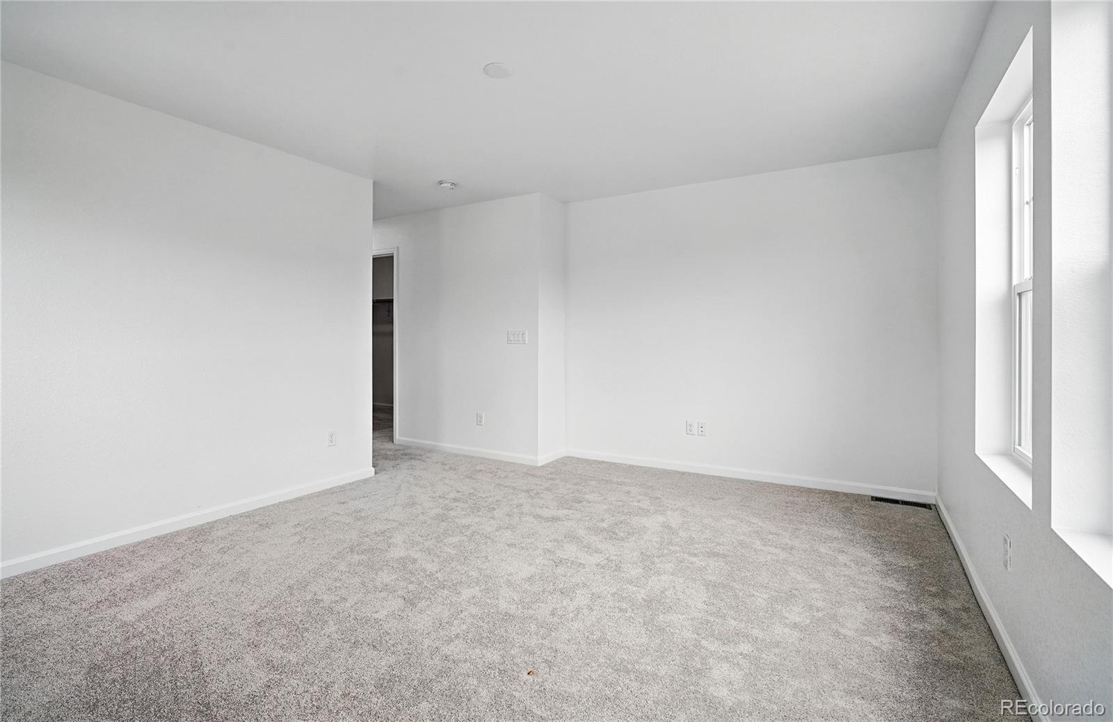 39713 Penn Road Elizabeth, CO 80107 - Photo 21 of 32 an empty room with windows