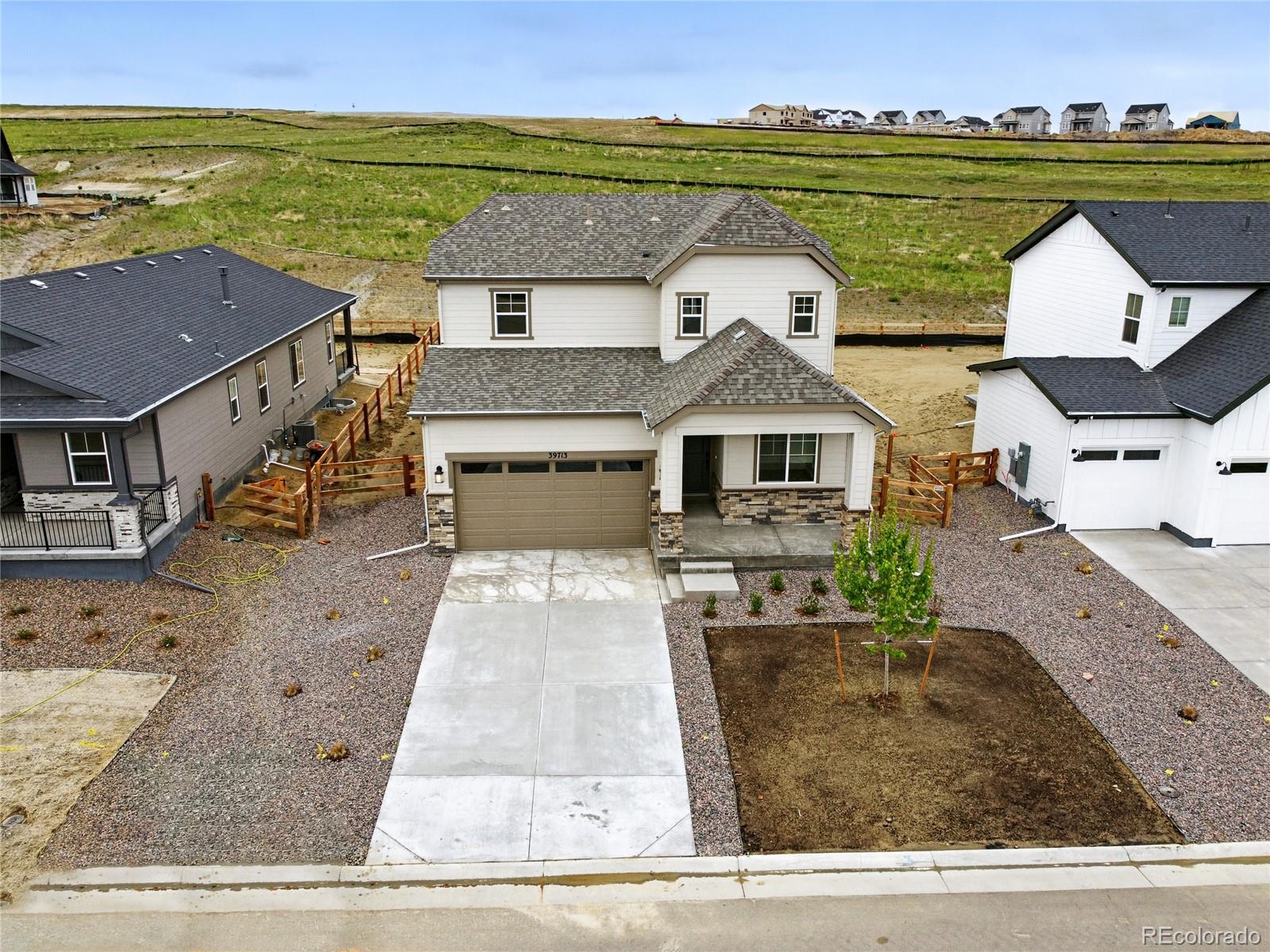 39713 Penn Road Elizabeth, CO 80107 - Photo 27 of 32 an aerial view of a house with a garden