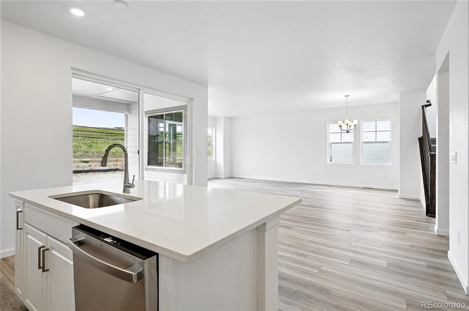 39713 Penn Road Elizabeth, CO 80107 - Photo 9 of 32 a kitchen with a sink a stove and cabinets