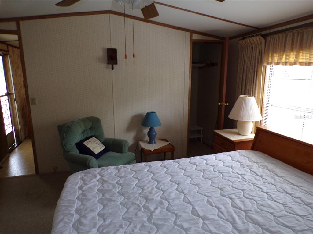 3239 Morrison Way Spring Hill, FL 34606 - Photo 11 of 17 a bedroom with a bed and a window