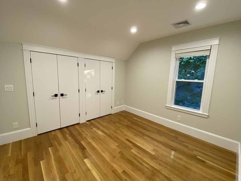 26 Playstead Road, Unit 2 Newton, MA 02458 - Photo 12 of 27 a view of empty room with window and wooden floor