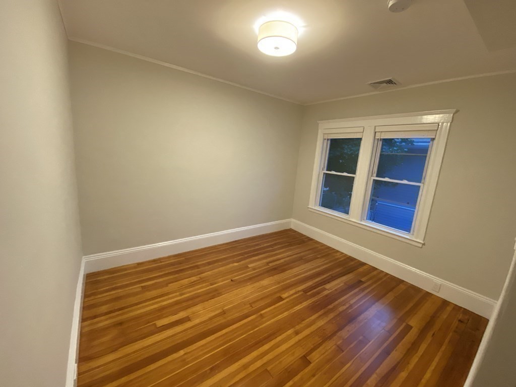 26 Playstead Road, Unit 2 Newton, MA 02458 - Photo 19 of 27 a view of empty room with wooden floor