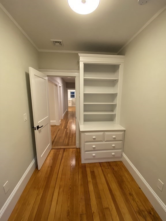 26 Playstead Road, Unit 2 Newton, MA 02458 - Photo 22 of 27 a view of walk in closet with empty racks