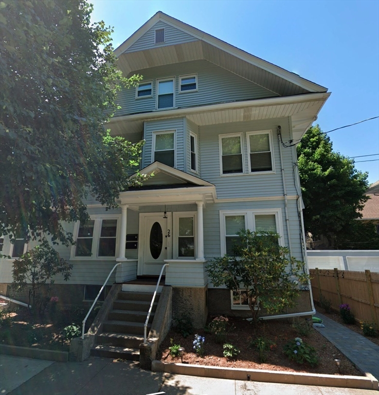 26 Playstead Road, Unit 2 Newton, MA 02458 - Photo 26 of 27 front view of a house with a yard