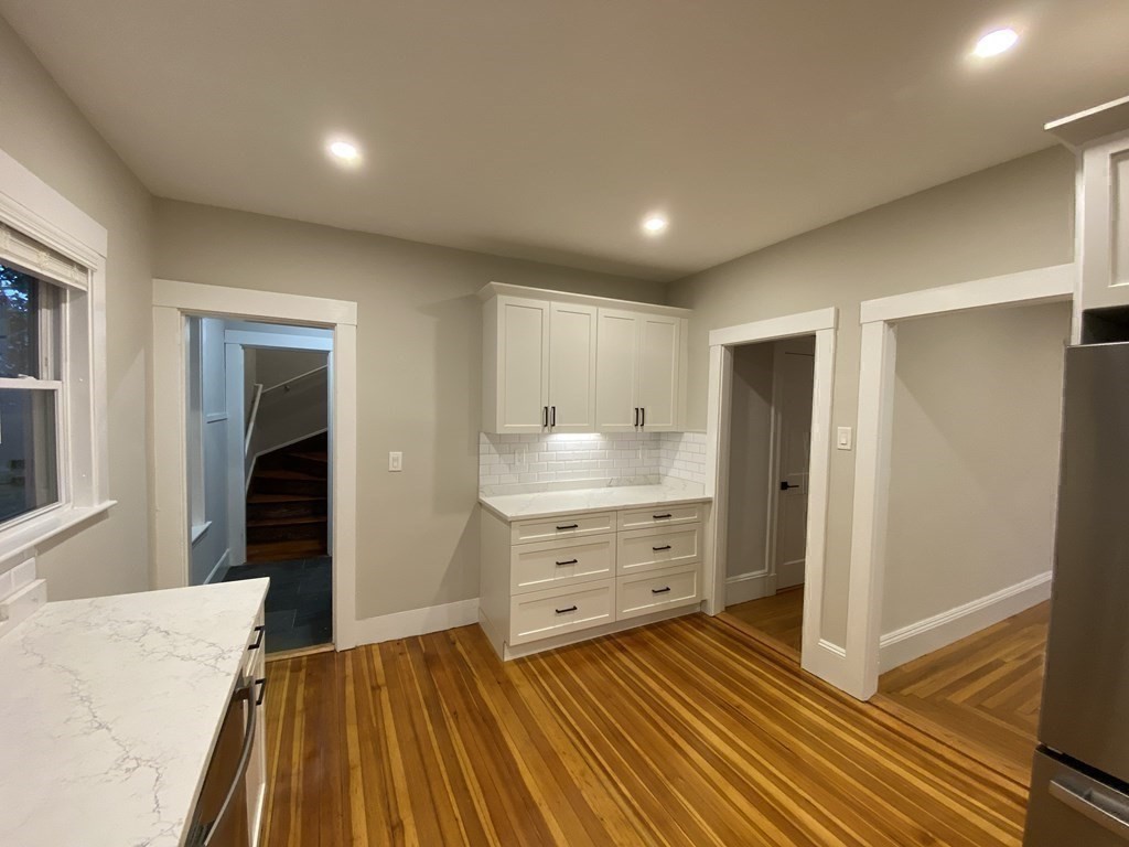 26 Playstead Road, Unit 2 Newton, MA 02458 - Photo 3 of 27 a room with a bed and cabinets