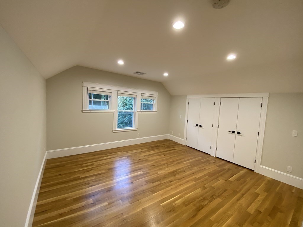 26 Playstead Road, Unit 2 Newton, MA 02458 - Photo 10 of 27 an empty room with wooden floor and windows