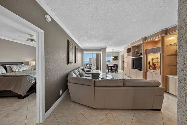 a view of a dining room with furniture and a window