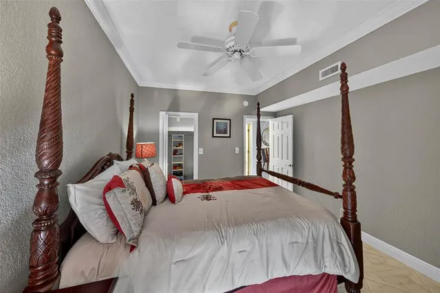 a front view of multi story residential apartment building with yard and entryway