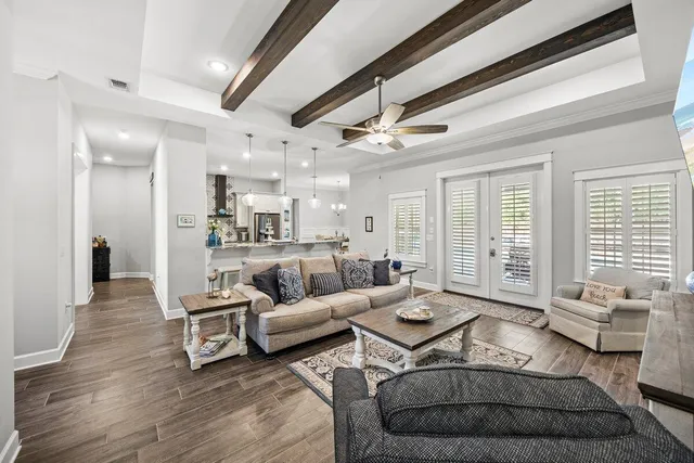 a bathroom with a granite countertop sink a mirror and a bathtub