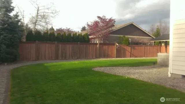 a view of backyard with green space