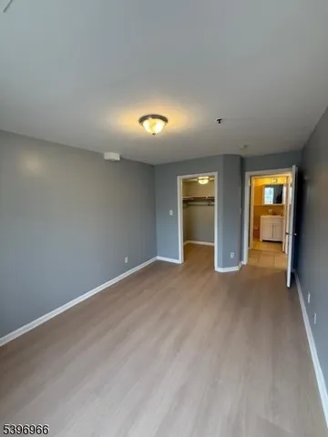 a view of an empty room and a window