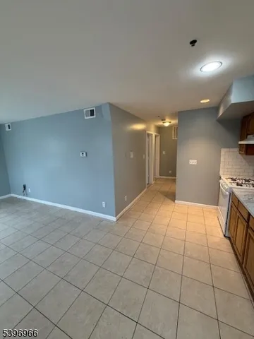 a view of a hallway with a sink