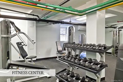 a room with lots of appliances and a table