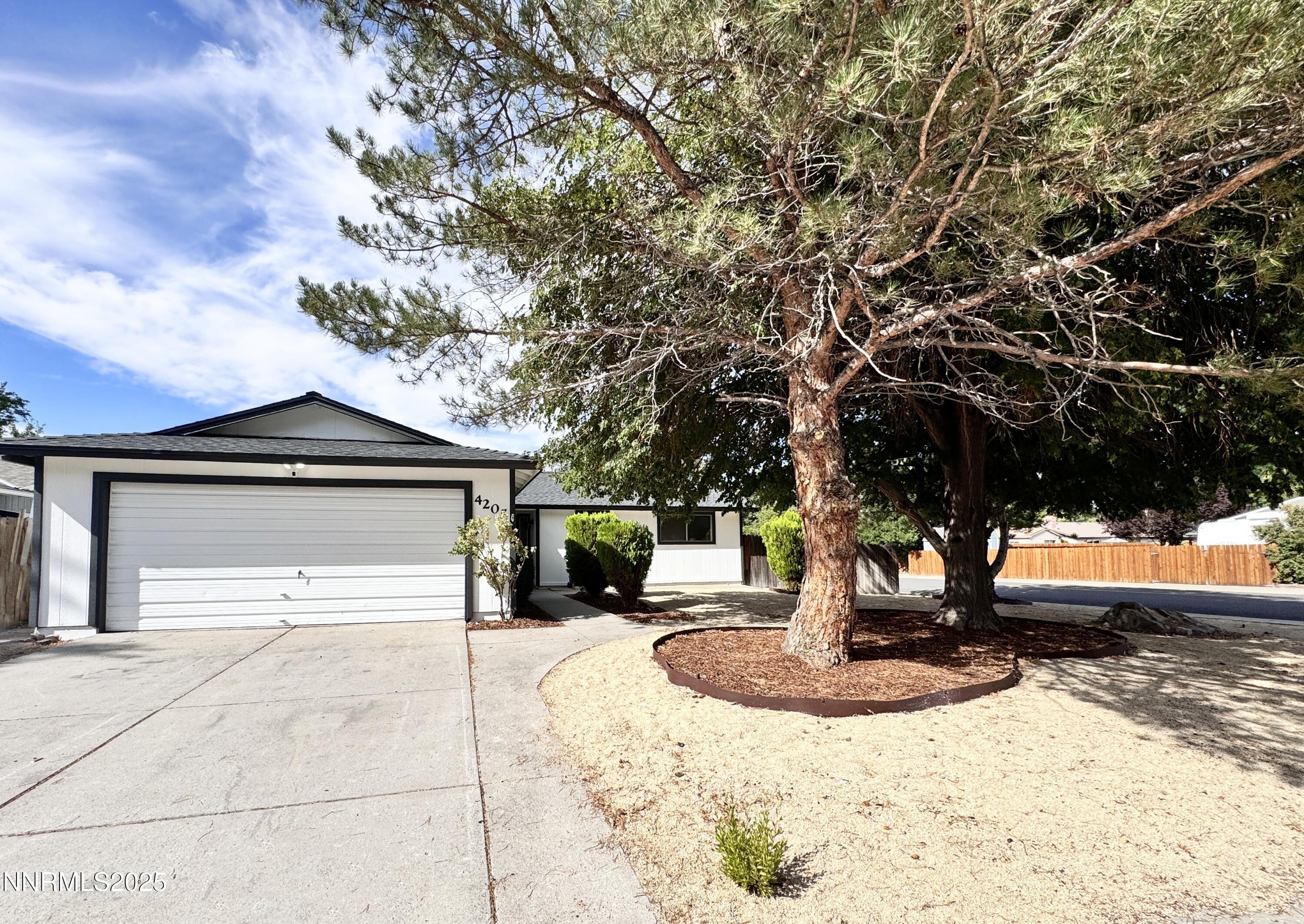 4205 Santa Maria Drive Reno, NV 89502 - Photo 1 of 23 a front view of a house with a yard