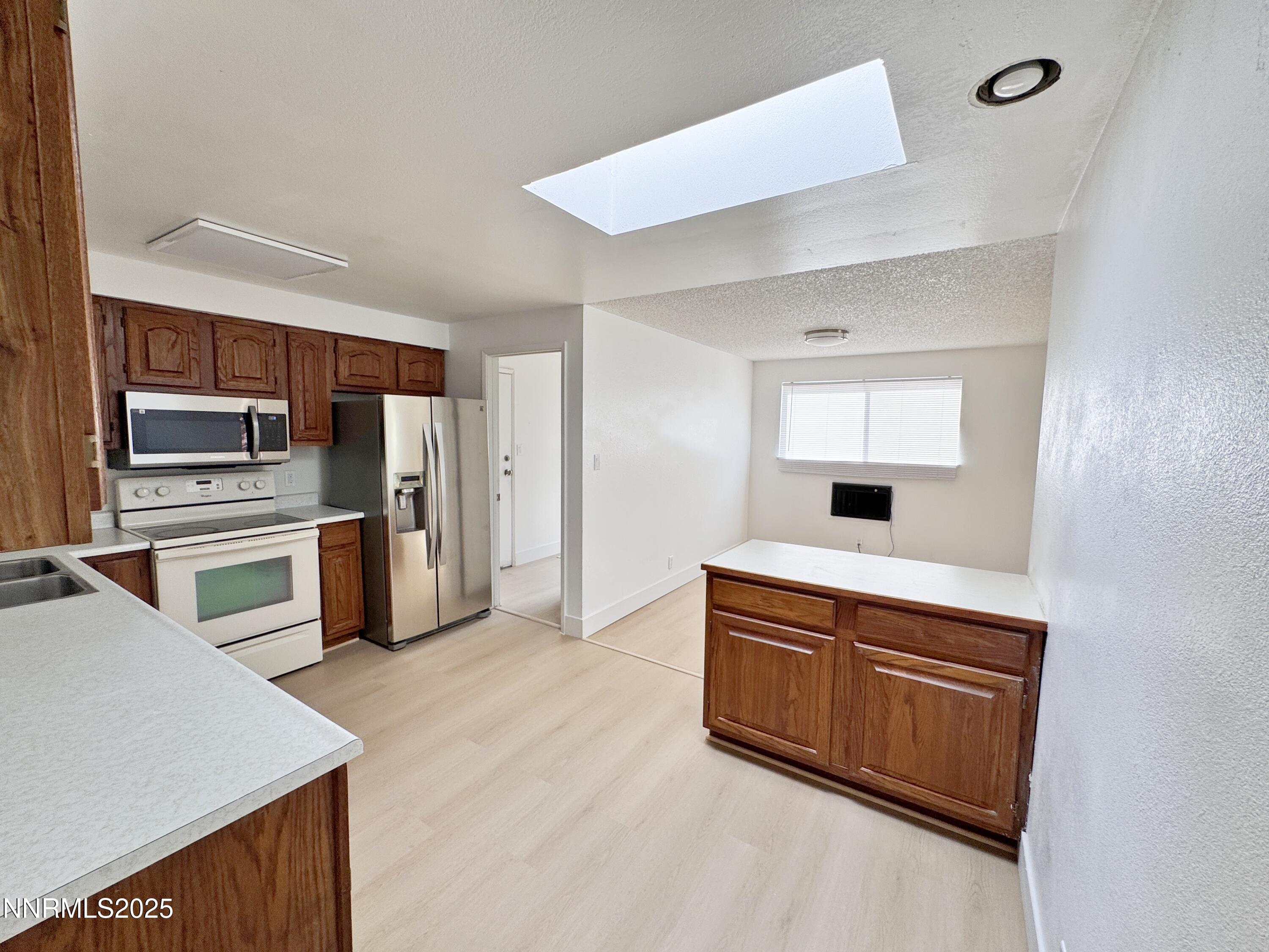 4205 Santa Maria Drive Reno, NV 89502 - Photo 11 of 23 a kitchen with stainless steel appliances a refrigerator and a stove